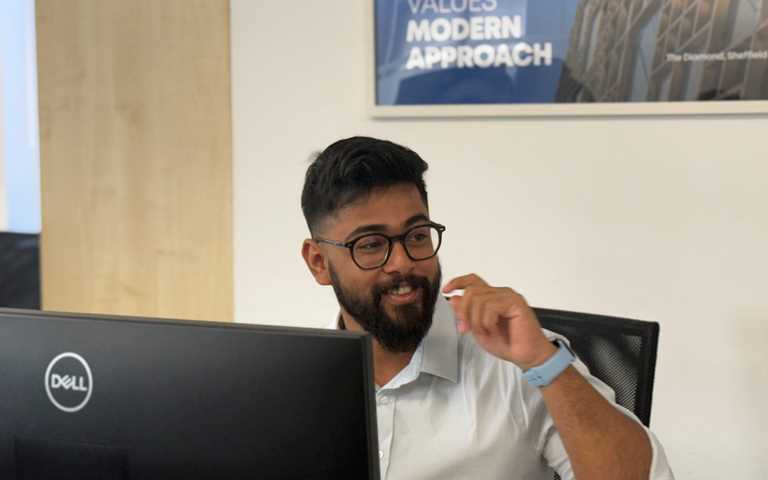 A Software Testing Consultant performing Functional Testing services on a tablet device with screen showing data and results