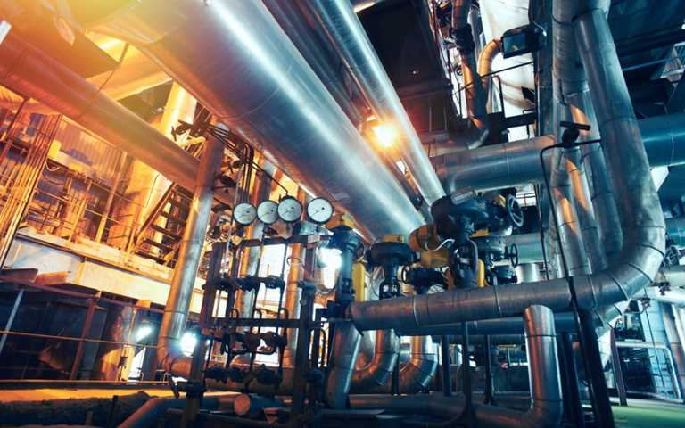 A utility engineering site with steel pipelines, valve and gauges